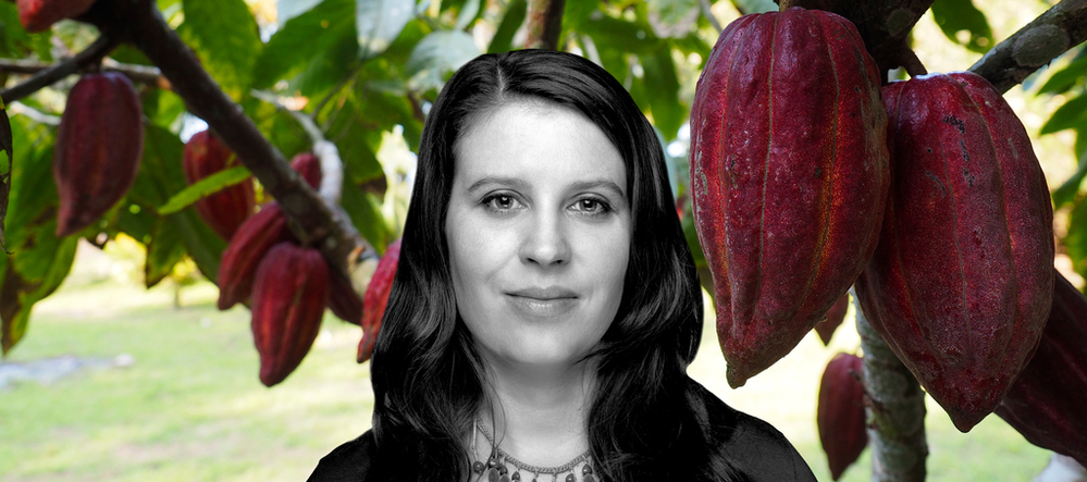 Dr. Izabela Stachowicz next to cocoa fruit